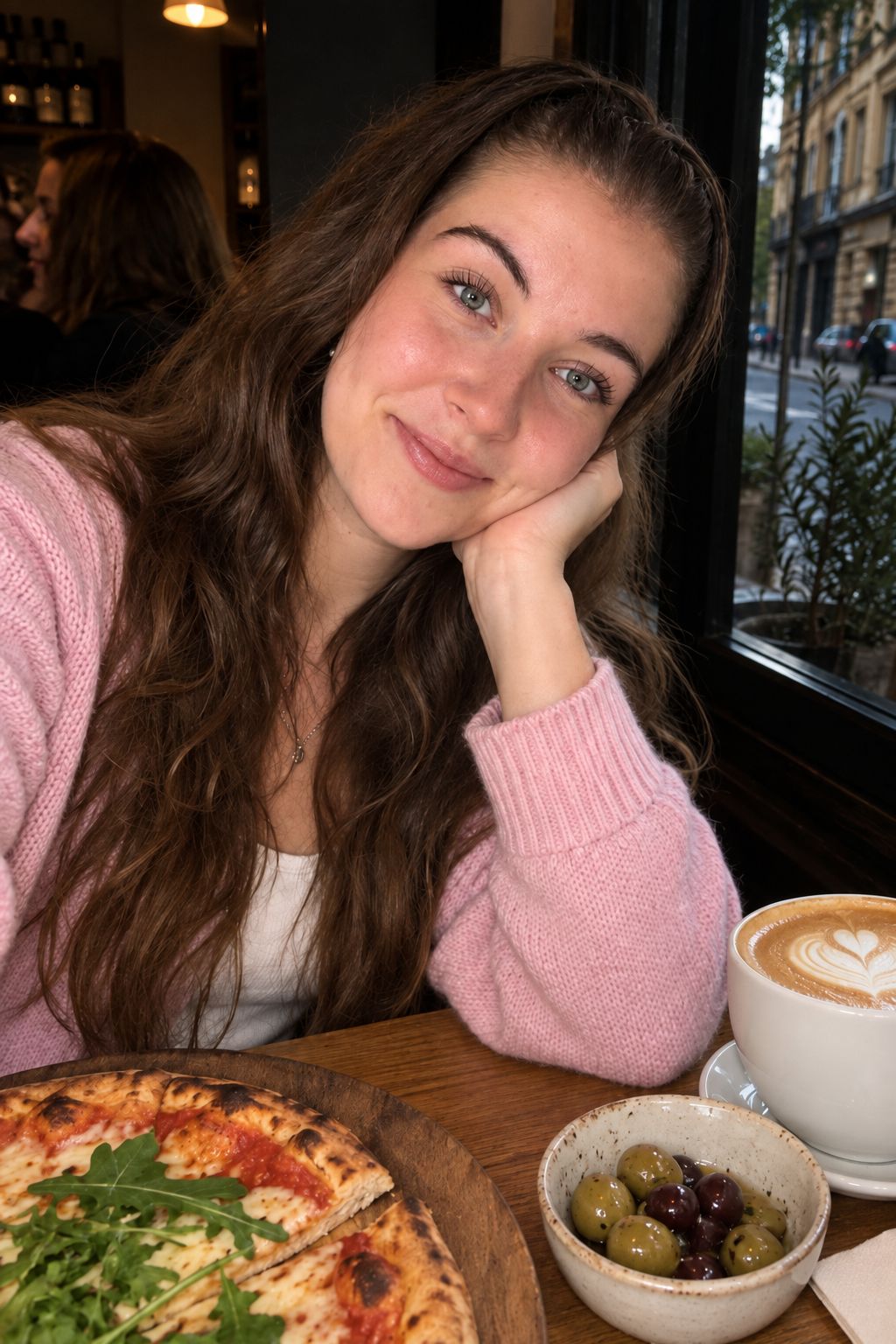 Same cafe window portrait after, face lifted, pose unchanged